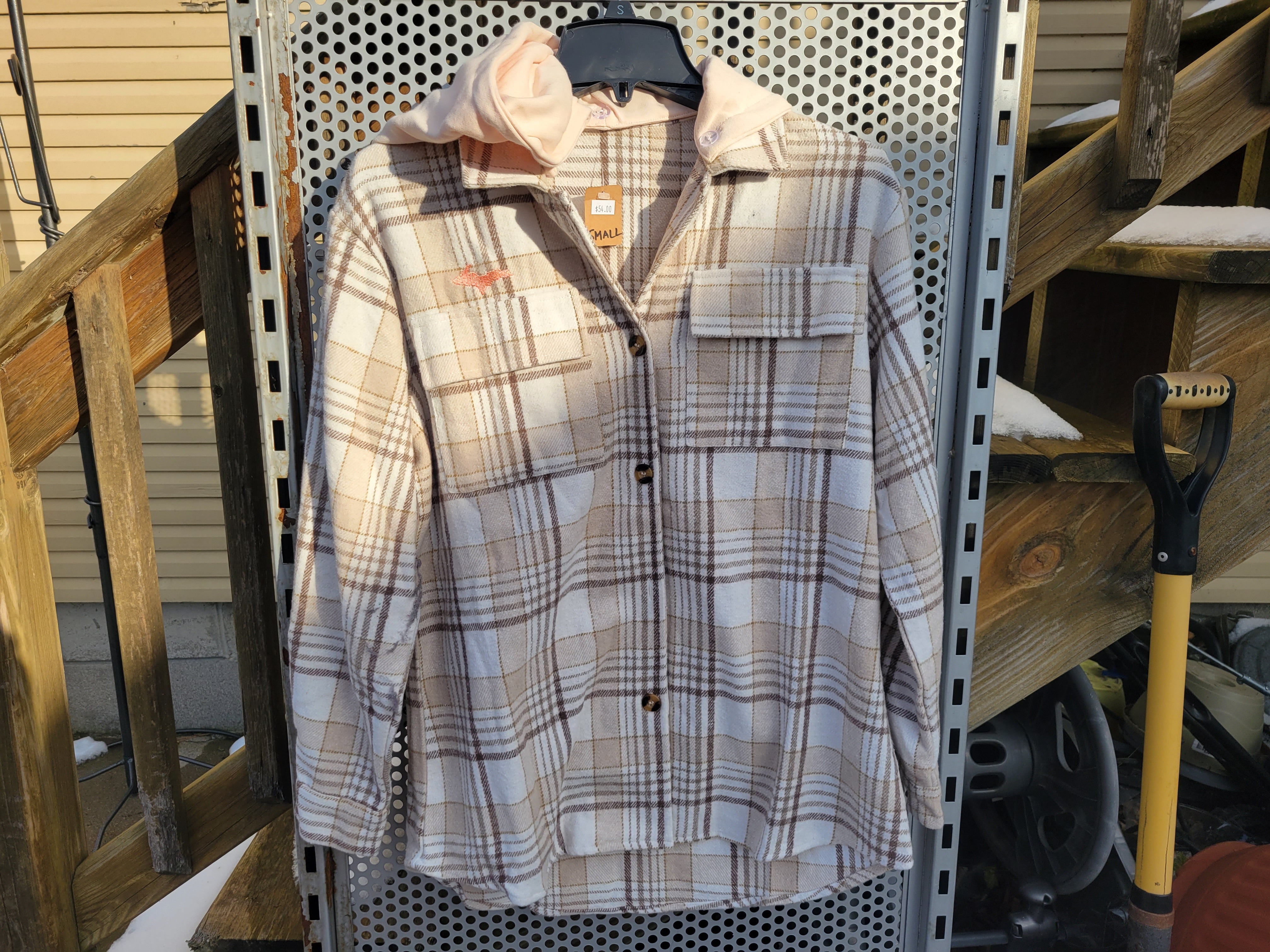 Light brown shacket with peach hood