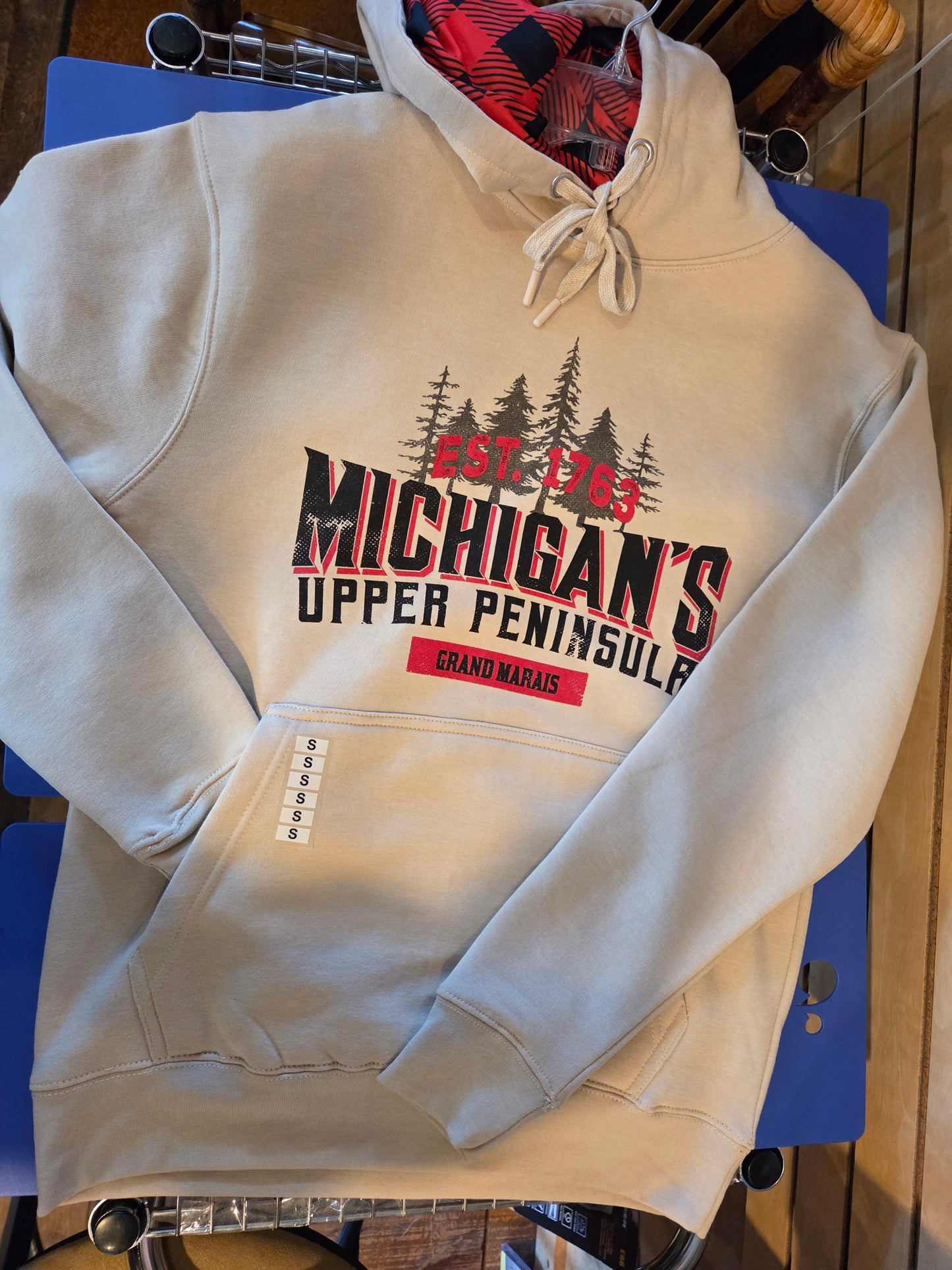 Oatmeal colored hoodie with plaid inside hood
