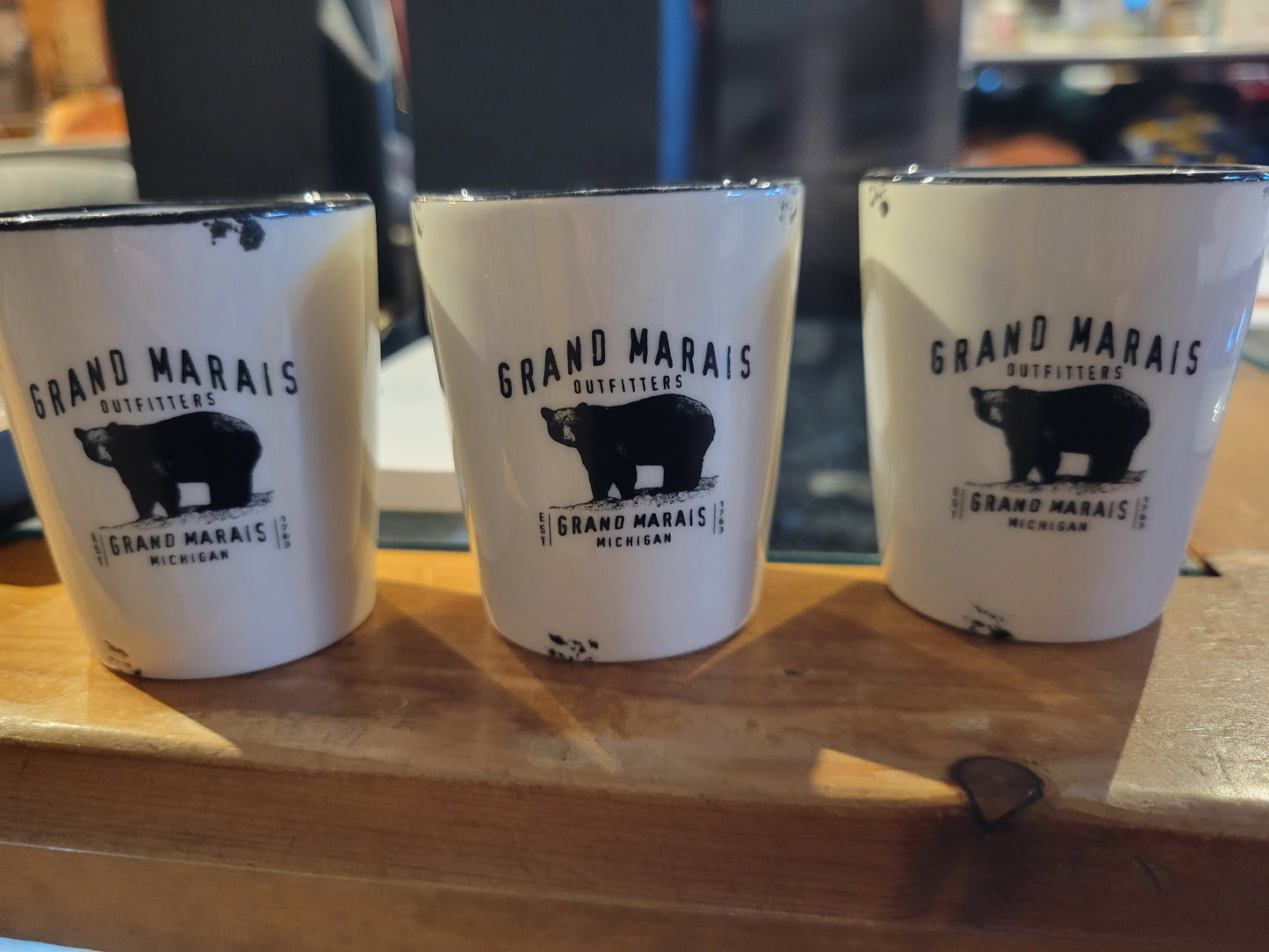 Ceramic shot glass with Grand Marais Bear