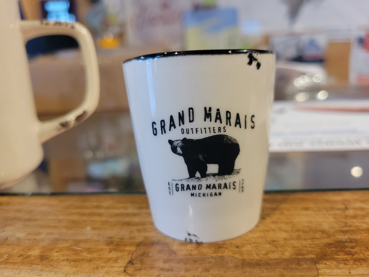 Ceramic shot glass with Grand Marais Bear