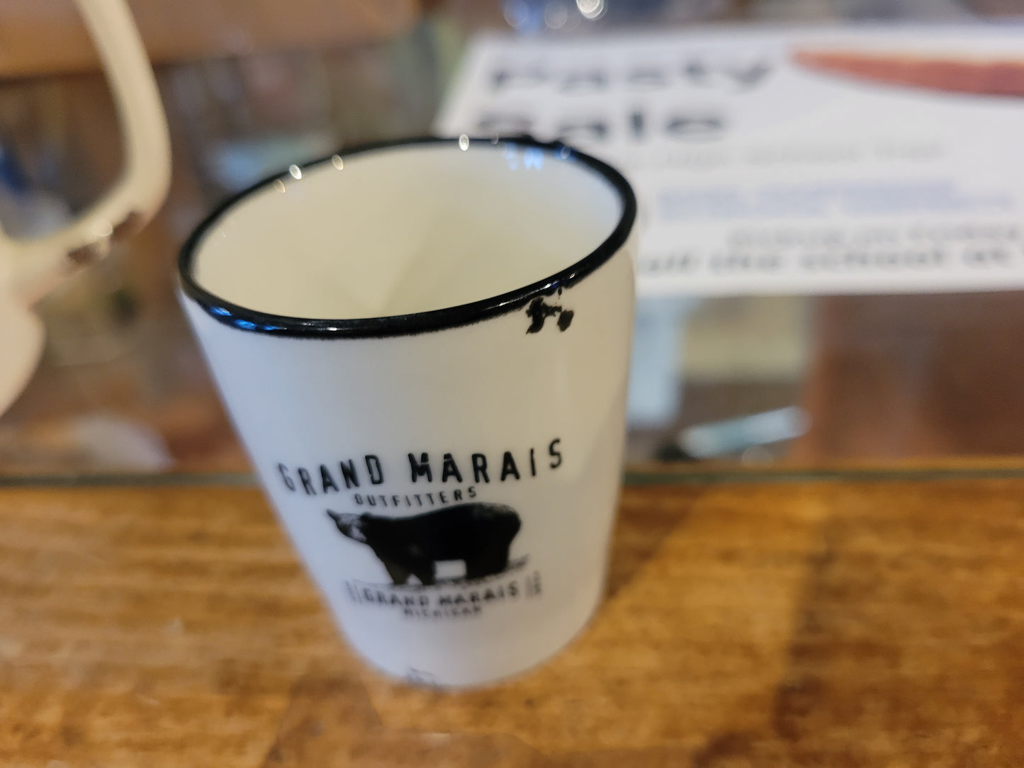 Ceramic shot glass with Grand Marais Bear