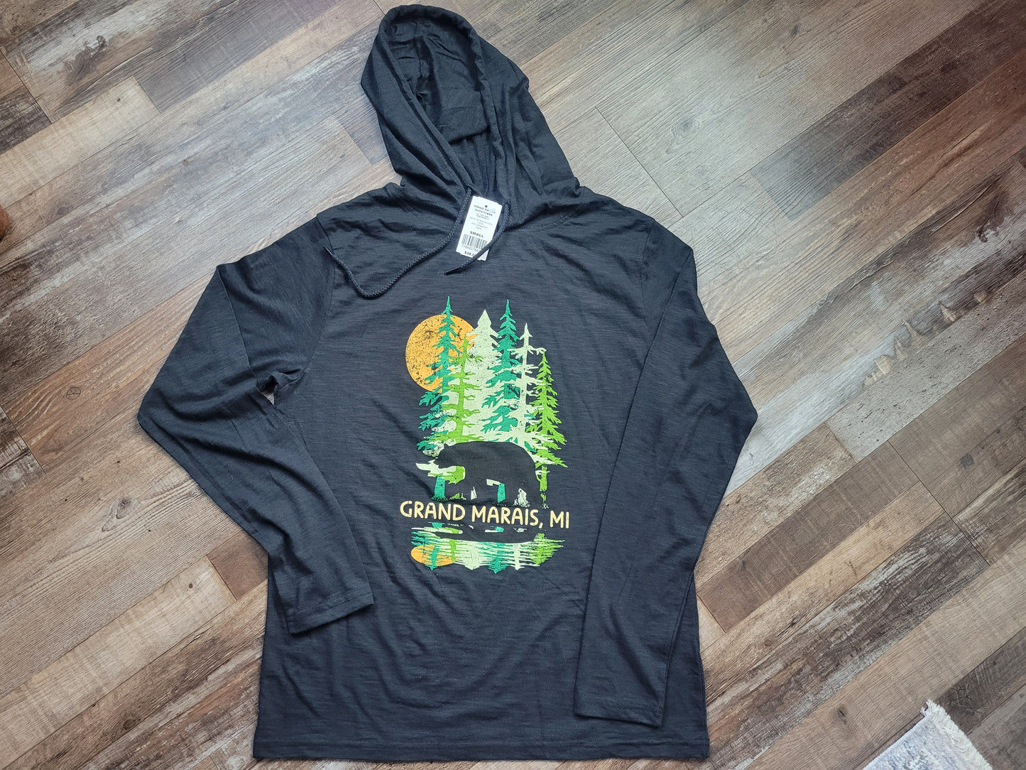 Tall trees with bear black shirt