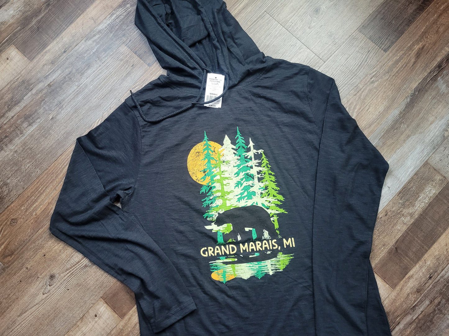 Tall trees with bear black shirt